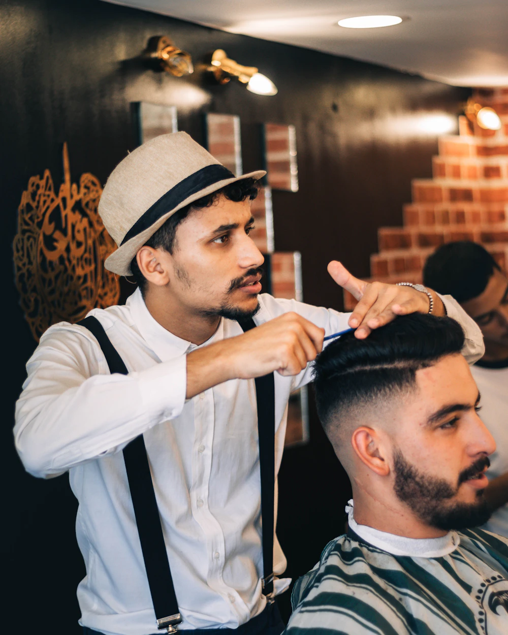A barber cutting a customer's hair